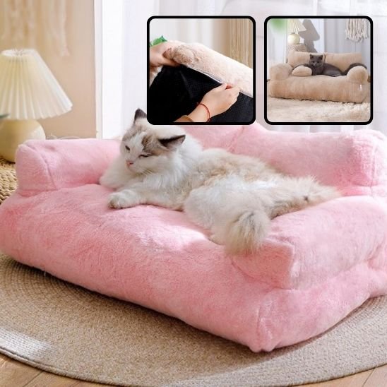 lit pour chat rose en forme de canapé avec un chat couche dessus