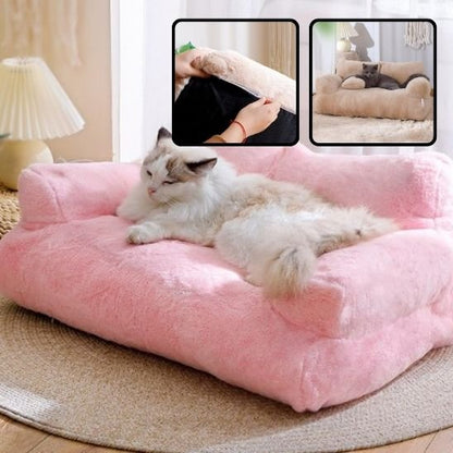 lit pour chat rose en forme de canapé avec un chat couche dessus