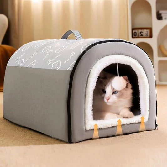 maison pour les chats grise avec chat dedans