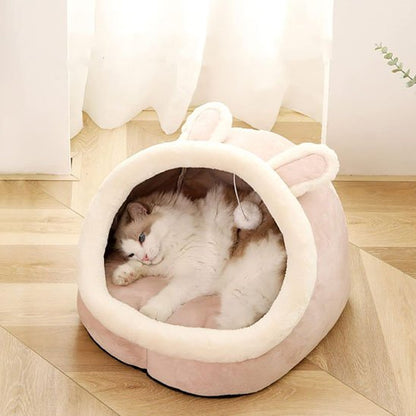 Niche chats tete de lapin rose avec grandes oreilles chat couche dedans